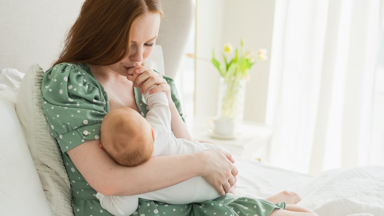 woman breastfeeding baby