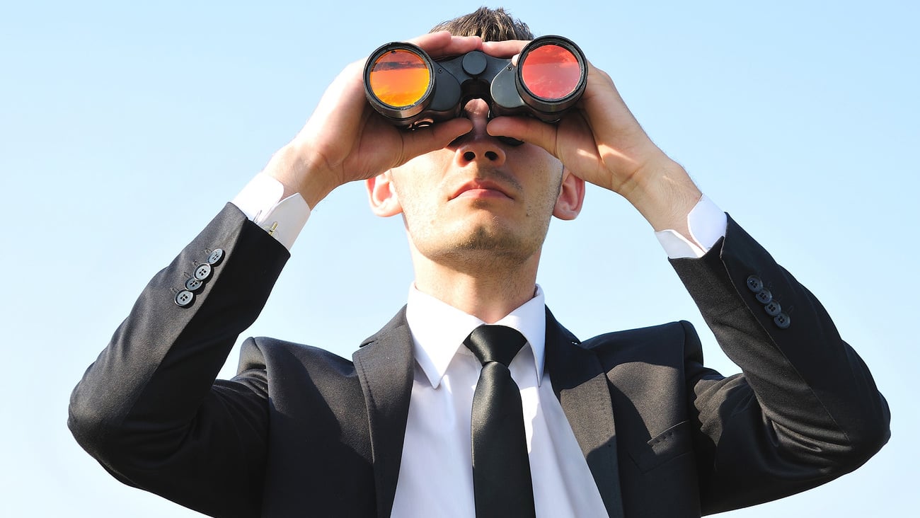 Business man with binoculars on sky; Shutterstock ID 107635607