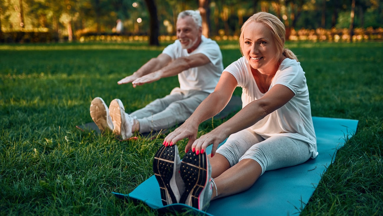 Senior couple is doing sport outdoors. Stretching in park during sunrise. Doing yoga together. Healthy lifestyle concept; Shutterstock ID 1195904440