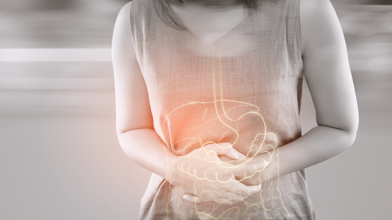 The photo of internal organs is on the women's body against gray background, Concepts of health problems; Shutterstock ID 1590784927