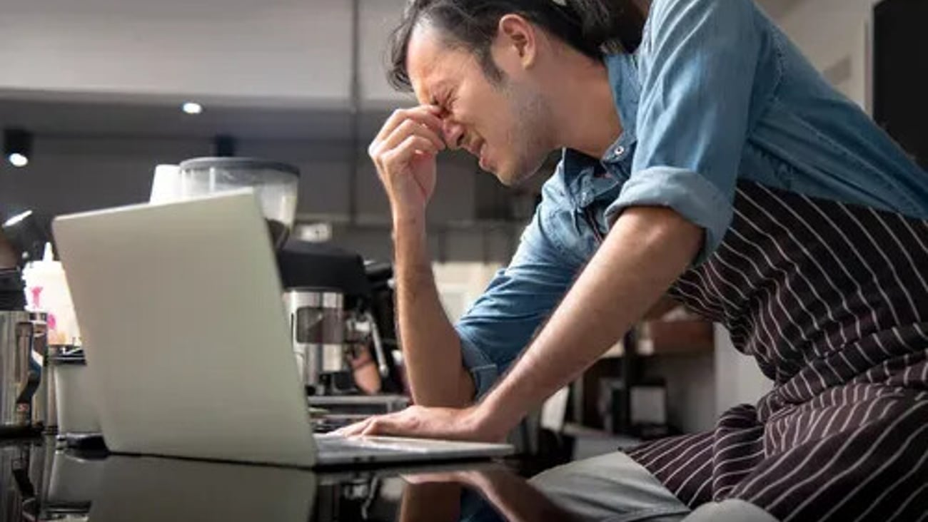 Cafe owner have anxiety with his cafe  continuous negative sales; Shutterstock ID 1818902903
