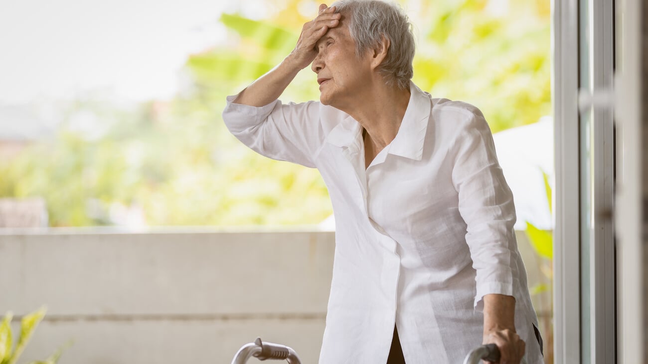Exhausted senior woman has headache dizziness from the sizzling summer temperatures,old elderly suffering from hot summer weather,symptoms of heat stroke,high temperature on a sunny day,feeling faint; Shutterstock ID 1954929409