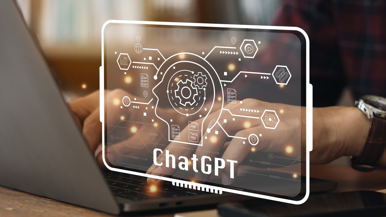 ChatGPT Chat with AI or Artificial Intelligence. Young businessman chatting with a smart AI or artificial intelligence using an artificial intelligence chatbot developed by OpenAI..; Shutterstock ID 2244714585