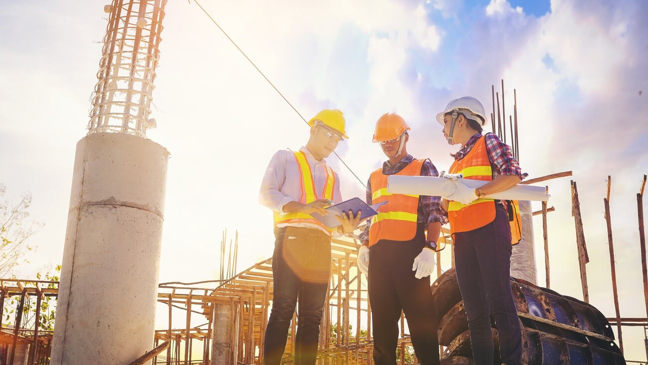 Structural engineer or architect and foreman worker with blueprints discuss, plan working for the outdoors building construction site. Construction collaboration concept; Shutterstock ID 2462684023