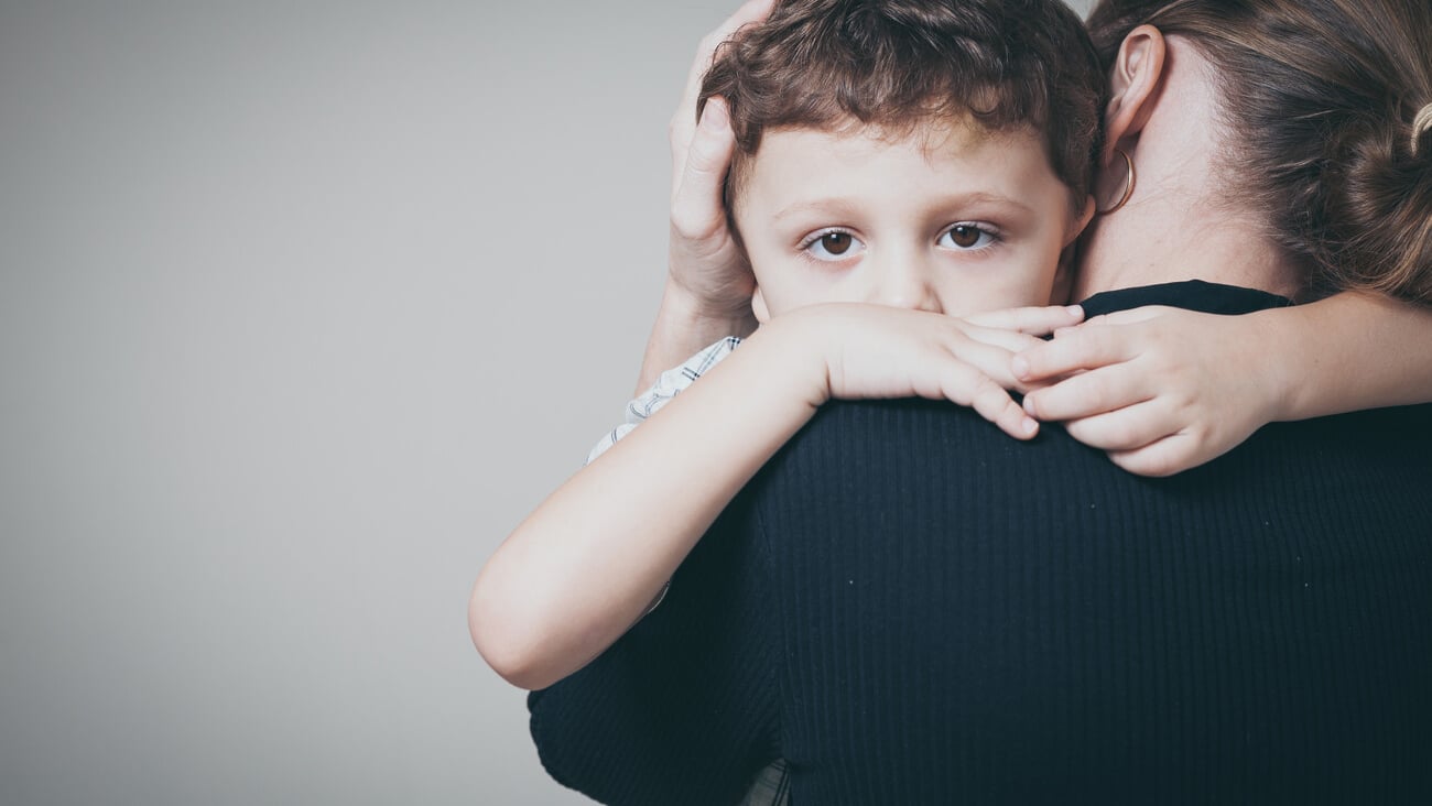 sad son hugging his mother at home. Concept of couple family is in sorrow.; Shutterstock ID 337104815