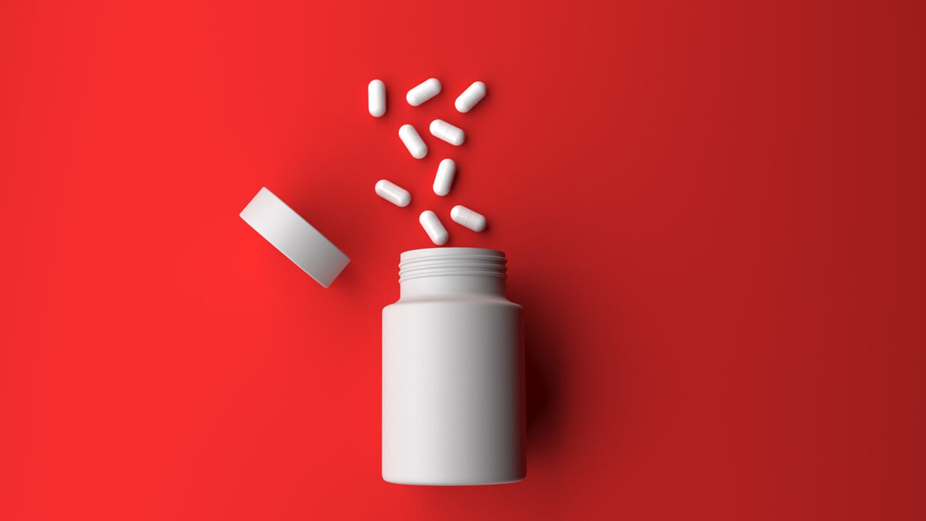 Pill bottle on red background for use in presentations, education manuals, design, etc 3D illustration; Shutterstock ID 572566072