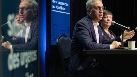 Frédéric Abergel et Véronique Wilson, de Santé Québec. Crédit: PC/ Christinne Muschi