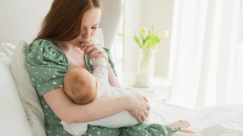 woman breastfeeding baby