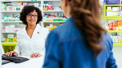 pharmacist speaking to patient