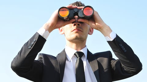 Business man with binoculars on sky; Shutterstock ID 107635607