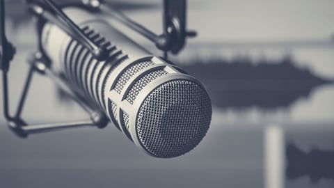 Professional microphone and sound wave form; Shutterstock ID 1337816078