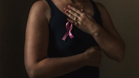 October is breast cancer awareness month,a woman holds a pink ribbon to support people living and sick.Health, international women's day and the concept of the world day of fight against cancer.Noise; Shutterstock ID 1533528356