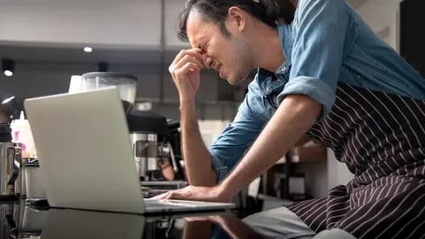 Cafe owner have anxiety with his cafe  continuous negative sales; Shutterstock ID 1818902903