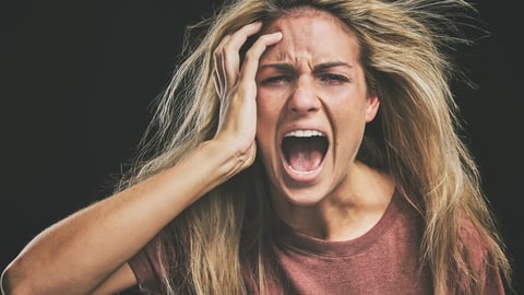 Face, mental health and screaming woman headache, anxiety or stress. Psychology, bipolar or crazy, insane or depressed schizophrenia female, shouting or hearing voices alone on dark studio background; Shutterstock ID 2211221465