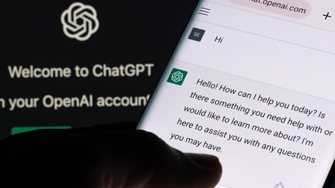ChatGPT chat bot screen seen on smartphone and laptop display with Chat GPT login screen on the background. A new AI chatbot by OpenAI. Stafford, United Kingdom, December 13, 2022.; Shutterstock ID 2237655785
