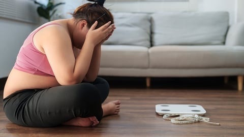 Stressful Asian overweight woman sad of dieting Weight loss fail..; Shutterstock ID 2267925001