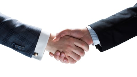 Isolated closeup image on white background. Businessmen holding hands in handshake. ; Shutterstock ID 289995089