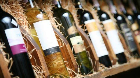Closeup shot of wine shelf. Bottles lay over straw. Wine cellar.; Shutterstock ID 47716741