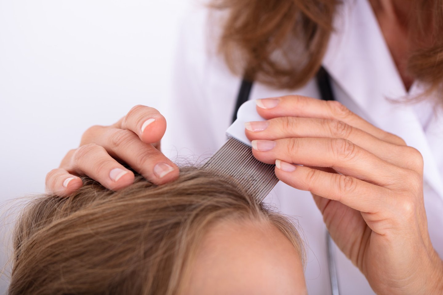 Close-up Of A Doctor Examining Girl's Hair With Comb; Shutterstock ID 1252772110